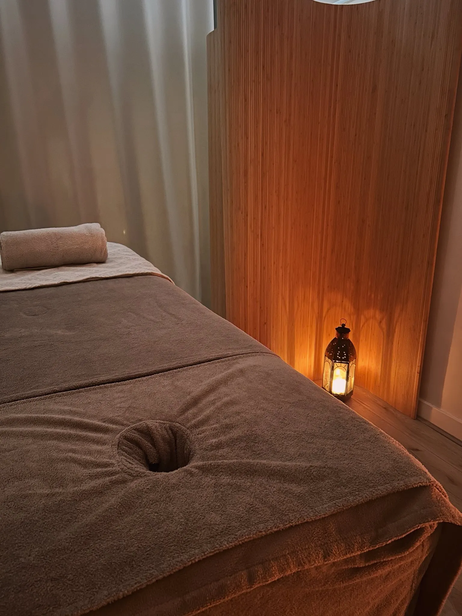 Hannah's calm, candle-lit treatment room at the Yoga Light Centre, Ruthin